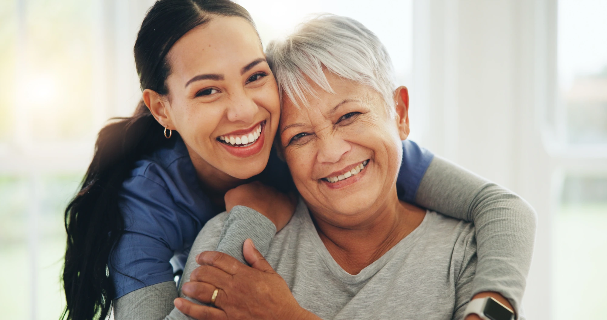 Nurse embracing an elderly patient