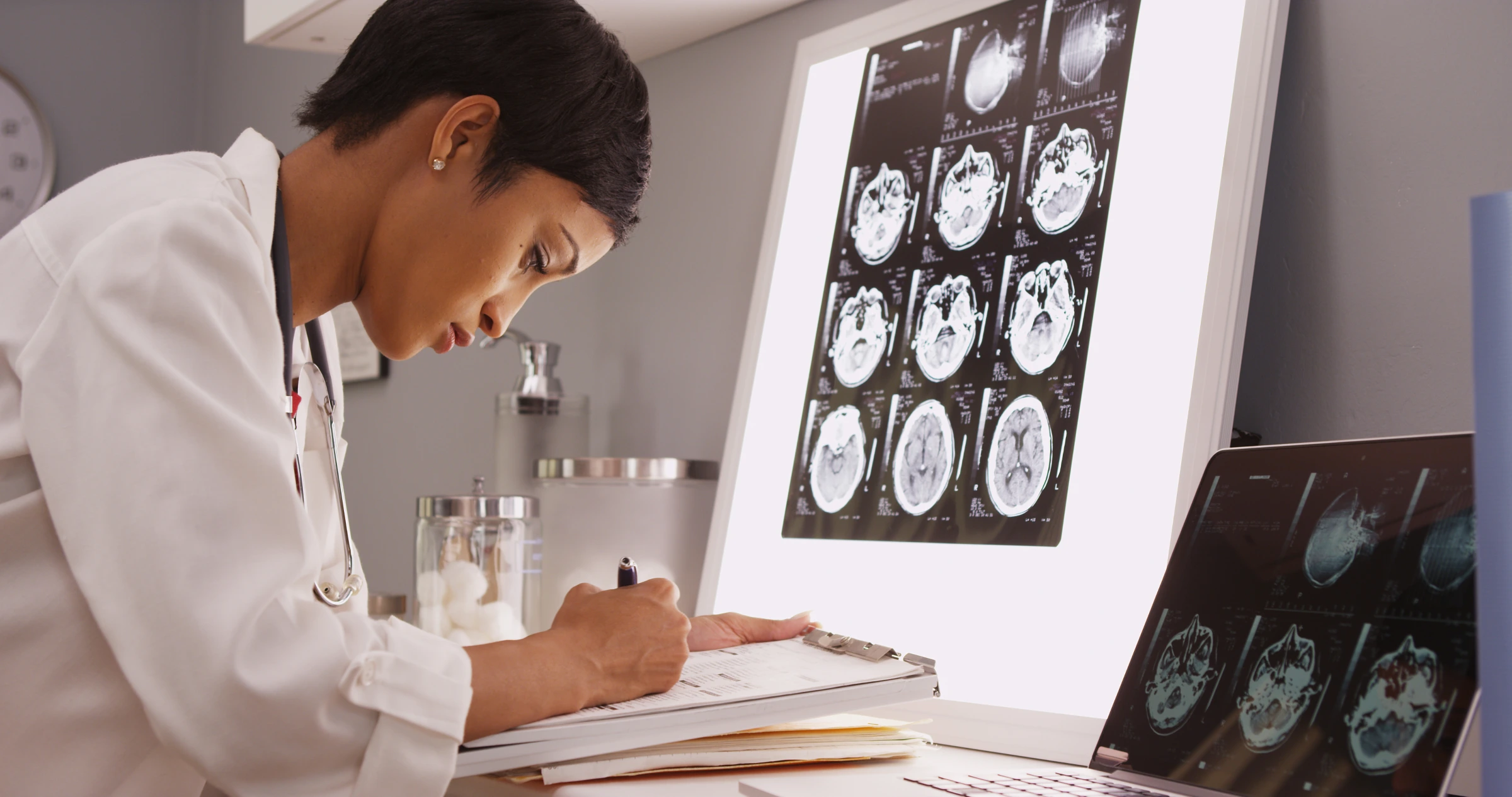 Doctor reviewing brain MRI scans